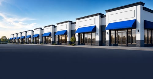 A row of identical franchise storefronts repeating into the distance, illustrating how franchising works as a proven system